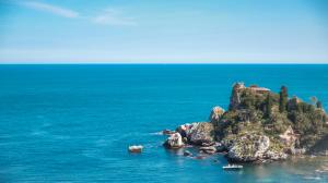 a small island in the middle of the ocean at Taormina Panoramic Hotel in Taormina
