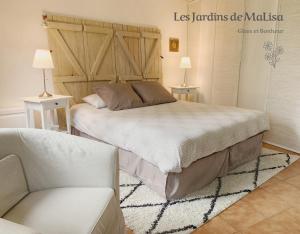 En eller flere senger på et rom på Les Jardins de MaLisa