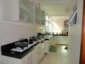 Una cocina o cocineta en Hotel Pousada Perdizes