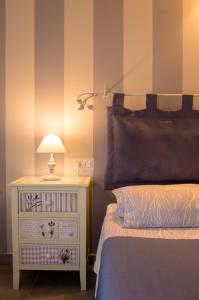 A bed or beds in a room at Il Fienile di Assisi