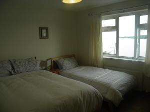 Ένα ή περισσότερα κρεβάτια σε δωμάτιο στο Bay View B&B Glandore