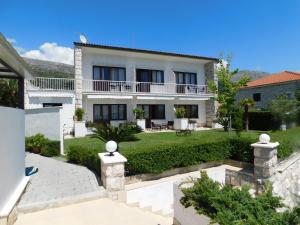 a villa with a view of the garden at Beach Villa Bozikovic in Podstrana