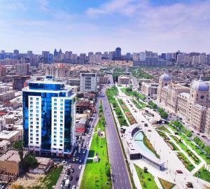 an aerial view of a city with buildings at Winter Park Hotel Baku in Baku