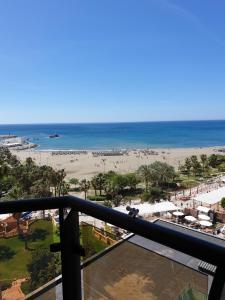 a view of the beach from the balcony of a resort at Puerto Marina in Benalmádena