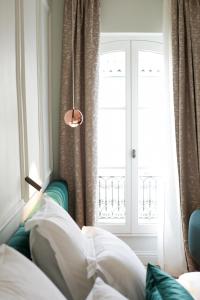 Postel nebo postele na pokoji v ubytování Hôtel Singulier Bordeaux - Boutique Hôtel & Spa Anne Semonin