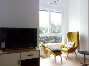 Televízia a/alebo spoločenská miestnosť v ubytovaní Apartamento Donostia Chic