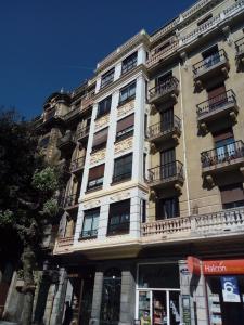 a tall building with balconies on the side of it at Apartamento Donostia Chic in San Sebastián