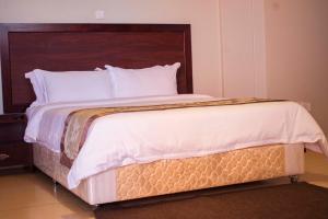 Postelja oz. postelje v sobi nastanitve Easy View Hotel Mbarara