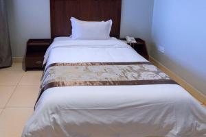 Postelja oz. postelje v sobi nastanitve Easy View Hotel Mbarara