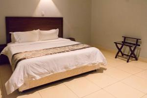 Postelja oz. postelje v sobi nastanitve Easy View Hotel Mbarara