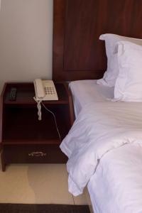 Postelja oz. postelje v sobi nastanitve Easy View Hotel Mbarara