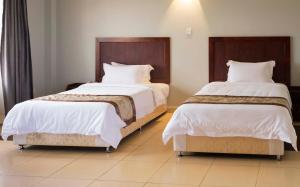 Postelja oz. postelje v sobi nastanitve Easy View Hotel Mbarara