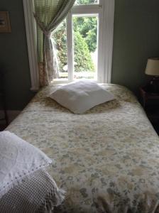 En eller flere senge i et værelse på Le Gîte des Soeurs