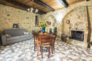 a living room with a table and a couch at Casa castello in Rocca Imperiale