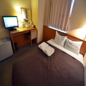 Posteľ alebo postele v izbe v ubytovaní Select Inn Nagoya Iwakura Eki-mae