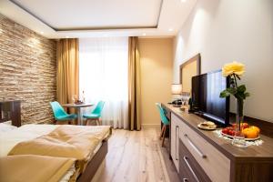 TV a/nebo společenská místnost v ubytování Hotel Viktor