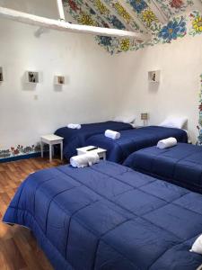Giường trong phòng chung tại Apartamento Cusco Queswa