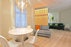 a living room with a table and a couch at The best of Copenhagen right at your doorstep no 1 in Copenhagen