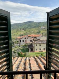 a view from a window of a village at Villino Chianti in Cavriglia