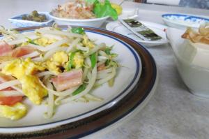 a plate of food on a table with food at Traveler's Inn Asanebo in Teshikaga