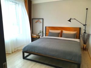 A bed or beds in a room at A&G Apartment