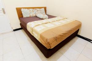 Letto o letti in una camera di JJ House Gejayan