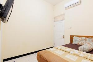 Letto o letti in una camera di JJ House Gejayan