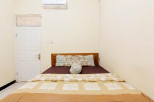 Letto o letti in una camera di JJ House Gejayan