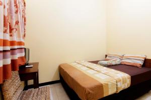 Letto o letti in una camera di JJ House Gejayan