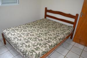 Krevet ili kreveti u jedinici u okviru objekta Condomínio Brisa da Praia - Casas com 2 dormitórios, churrasqueira privativa e 3 vagas de garagem