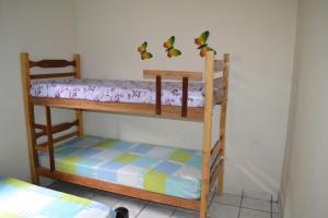 Postel nebo postele na pokoji v ubytování Casas em Condomínio próximo da praia com 2 dormitórios, churrasqueira e 3 vagas de garagem + 33 fotografií