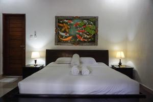 Postel nebo postele na pokoji v ubytování Ary Guest House