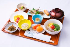 a tray with bowls of food on a table at Nanshukan in Kagoshima