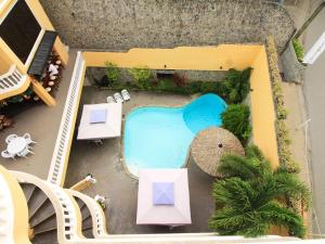 an overhead view of a pool at a resort at Mermaid Resort and Dive Center in Puerto Galera