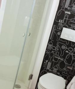 a bathroom with a toilet and a shower at ibis Shanghai Expo Chenshan Road Subway Staion Hotel in Shanghai