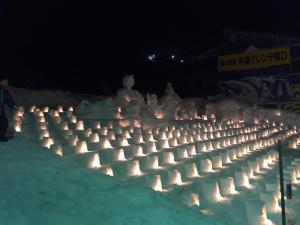 a group of people making a sand castle in the snow at KKR Yuzawa Yukiguni in Yuzawa
