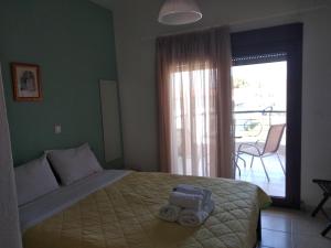 A bed or beds in a room at Angelo Studios