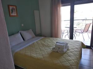 A bed or beds in a room at Angelo Studios