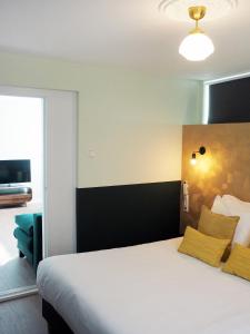 Voodi või voodid majutusasutuse Hotel Sebel toas