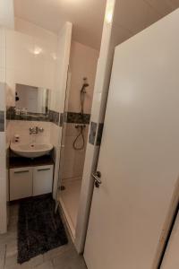 Kylpyhuone majoituspaikassa Apartment Gondola