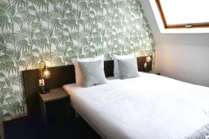 Voodi või voodid majutusasutuse Hotel Sebel toas