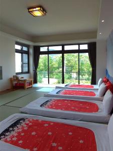 Rúm í herbergi á Yulaikung B&B