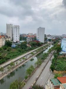 a view of a city with a river and buildings at Hoa Phuong Hotel in Hai Phong