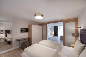 Postel nebo postele na pokoji v ubytování Hotel Bergwelt