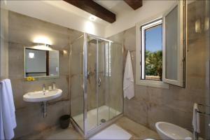 a bathroom with a glass shower and a sink at Villa Antonia - Vasca Idromassaggio Terrazza Vista Mare in San Vito lo Capo +45 photos