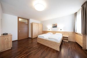 Postel nebo postele na pokoji v ubytování Hotel Masatsch