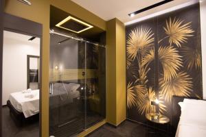 a bathroom with a shower with a glass door at napoliurbansuite in Naples +70 photos