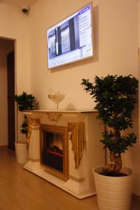 En tv och/eller ett underhållningssystem på Hotel City Inn Hamburg-Mitte