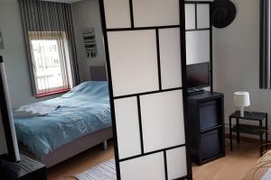 Ein Bett oder Betten in einem Zimmer der Unterkunft BnbMarlies