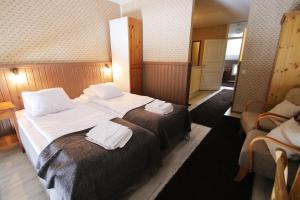 Postel nebo postele na pokoji v ubytování Hotel Hullu Poro
